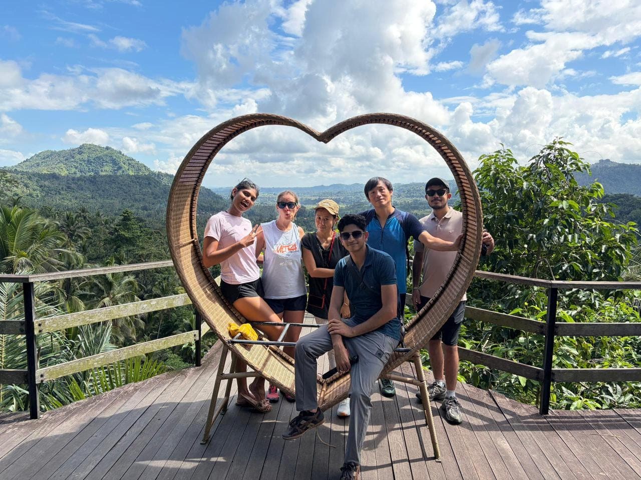 Heart frame, jungle vista behind · Friday wrap