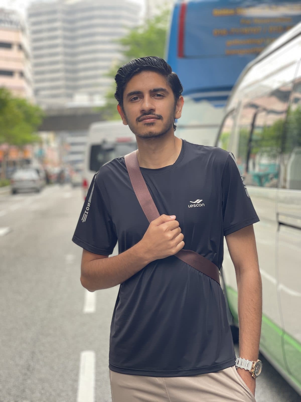 Street portrait in Kuala Lumpur with a crossbody bag